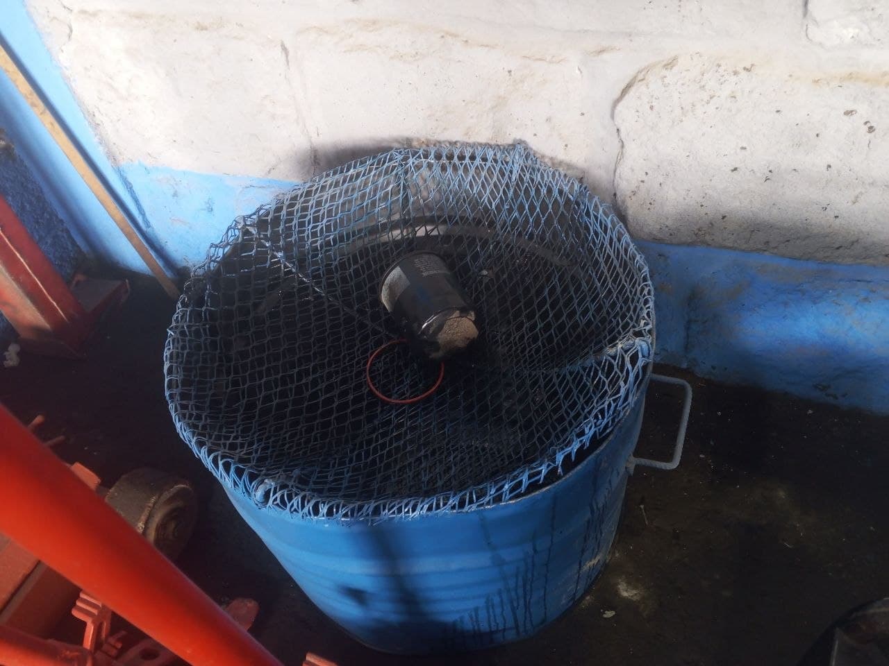 Used oil filter disposal station in the service workshop