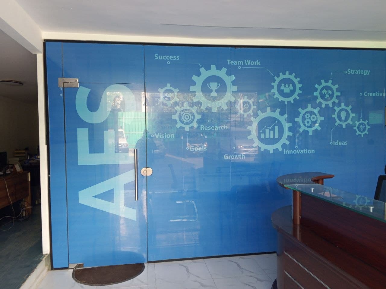 AFS office entrance with branded glass door and reception area